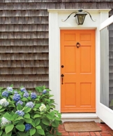 front home painted bright tangerine, foolproof staging tips from designers