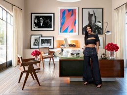 Kourtney inside her home business office, that is furnished with a classic Jules Leleu table and Pierre Jeanneret chairs; the arrangement of art includes Harry Benson's photo of Mia Farrow and Frank Sinatra at Truman Capote’s Black and White Ball; a vibrant work with report by Bridget Riley; and Batman, a gelatin silver-print by Herb Ritts.