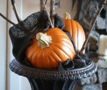 Easy Hallowen Decorations: A black urn filled with faux pumpkins and limbs