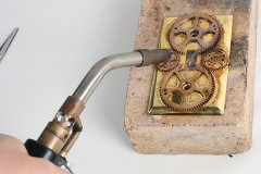 Soldering metal with a torch - Steampunk Decor